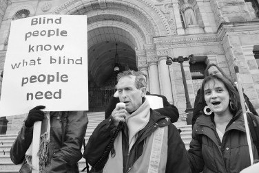 Graeme McCreath and Elizabeth Lalonde at the steps of the Legislature in Victoria, BC.