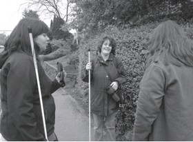 Blind People in Charge participants on a Victoria sidewalk. 