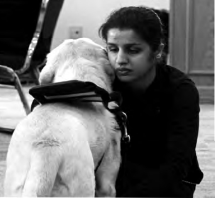 Soma Ali and guide dog Mimi.