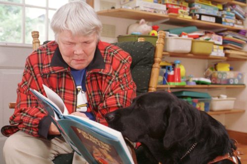 Photo: Children's author Jean Little reads from Jess was the Brave One to her biggest fan, her sight dog, Ritz, at her old stone farmhouse in Elora, Ont., on Sept. 23, 1997. SIMON WILSON/SIMON WILSON VIA THE CANADIAN PRESS