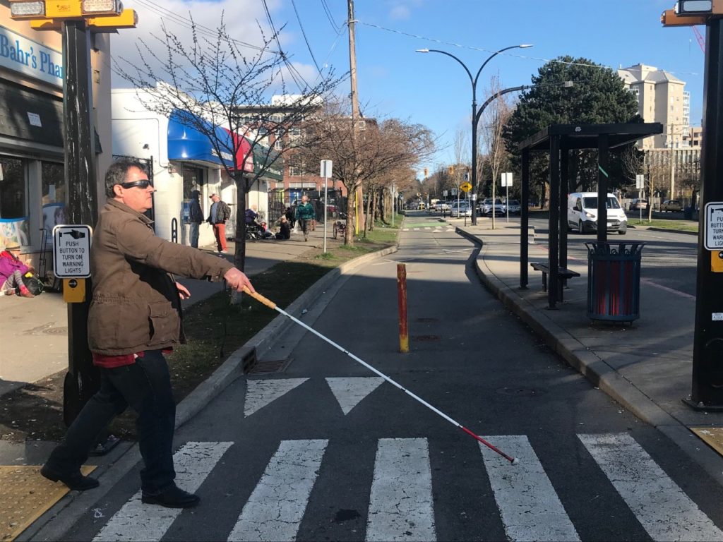 CFB President Doug Lawlor crosses a Pandora Ave                                       bike lane in Victoria to get to a floating island bus stop.