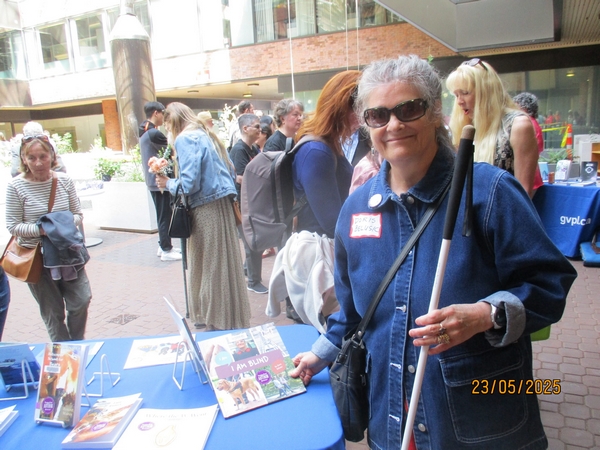 Doris Belusic holding a copy of her book ,I Am Blind (Photo by Thelma Fayle)